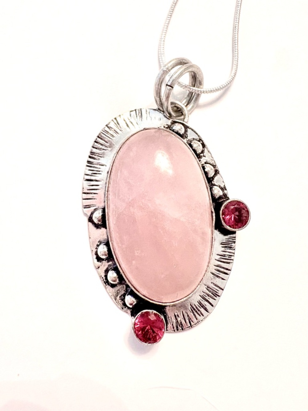 2 inch, Rose Quartz, and Pink Topaz, 925 marked pendant on a silver chain.